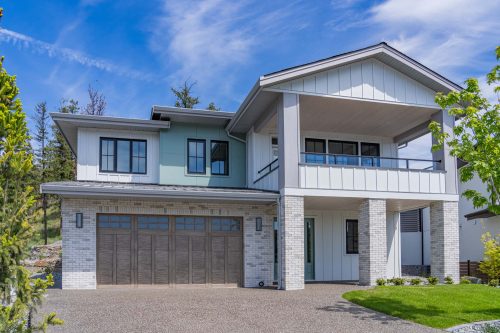 Angled exterior shot of 278 Summer Wood Drive, a contemporary Wilden home with a garage and balcony