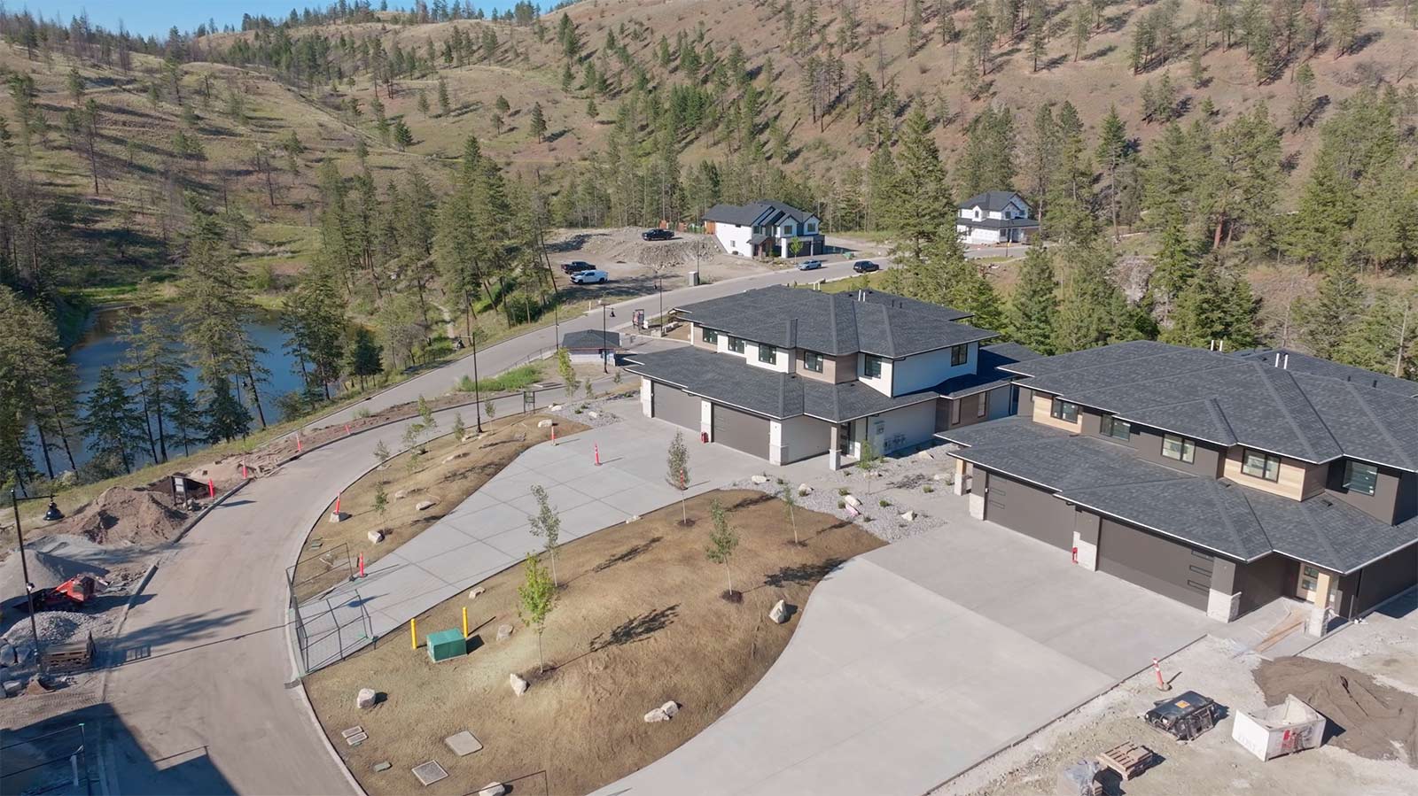 duplex homes kelowna view of front of homes with long driveways connecting to the road
